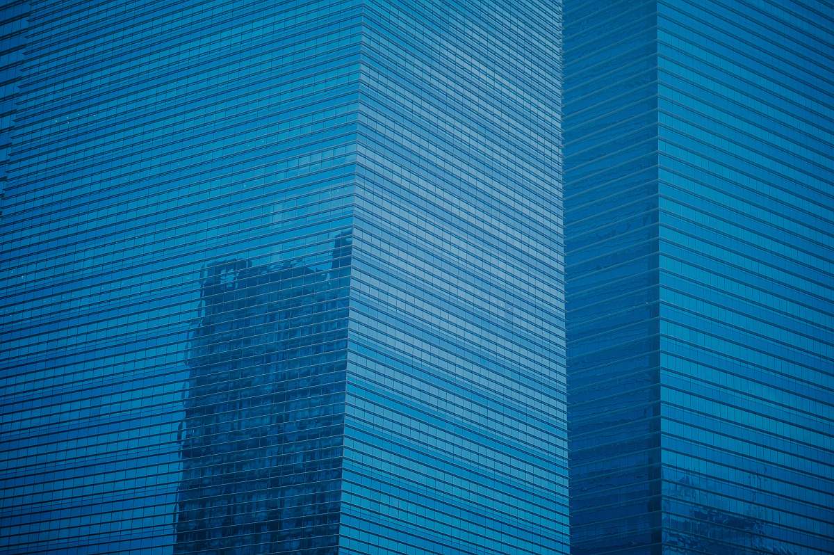 office building high-rise building with glass windows blue